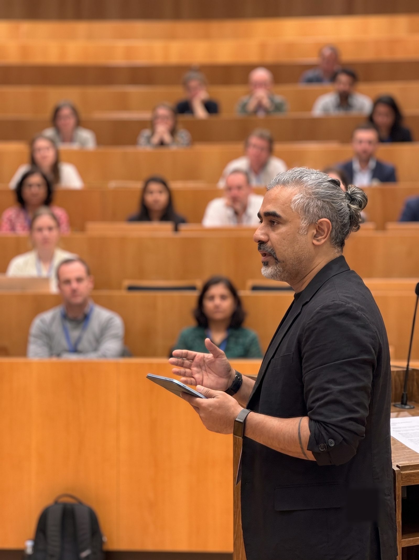 Arpit Gaind presenting at a conference lecture hall